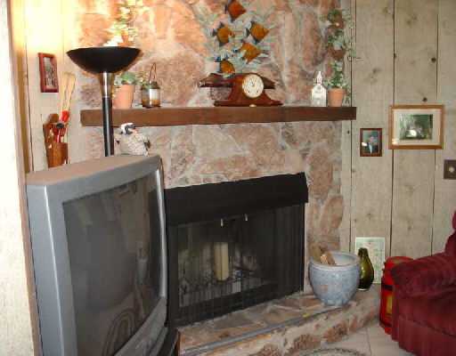 16521 Alexander Run Jupiter, FL 33478 - Photo 15 of 15 a room with furniture and a fireplace