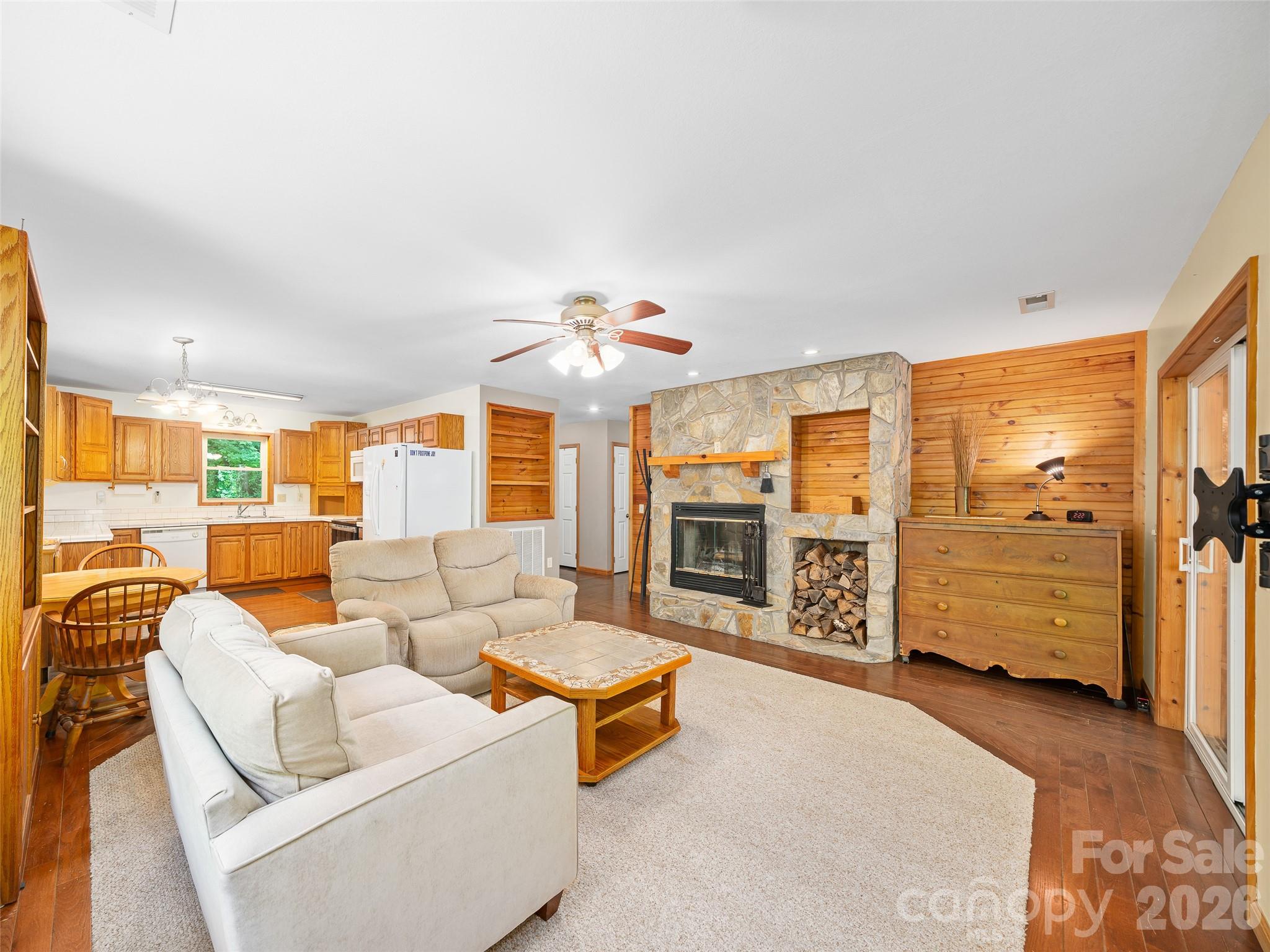 142 Wildflower Road Spruce Pine, NC 28777 - Photo 7 of 46 a living room with furniture and fireplace