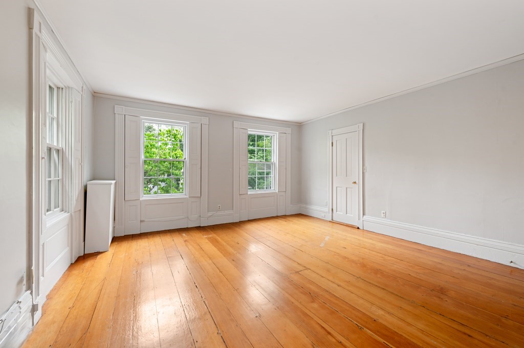 29 Follen Street Cambridge, MA 02138 - Photo 18 of 32 a view of an empty room with wooden floor and a window