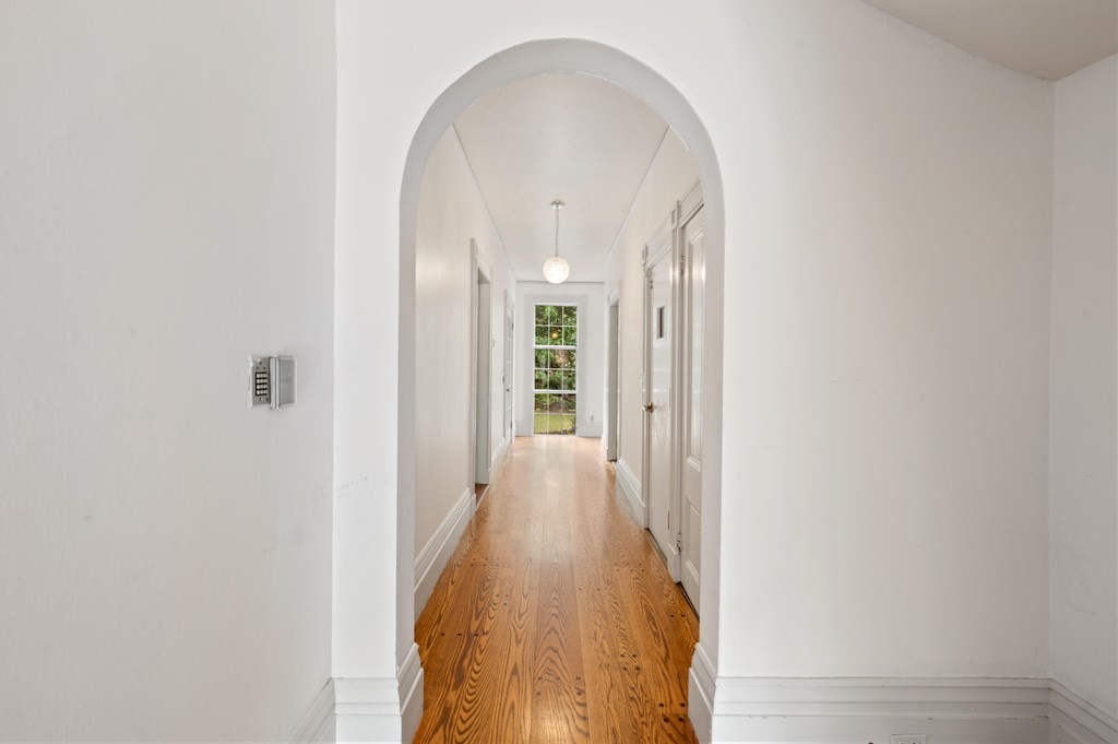 29 Follen Street Cambridge, MA 02138 - Photo 10 of 32 a view of a hallway with wooden floor