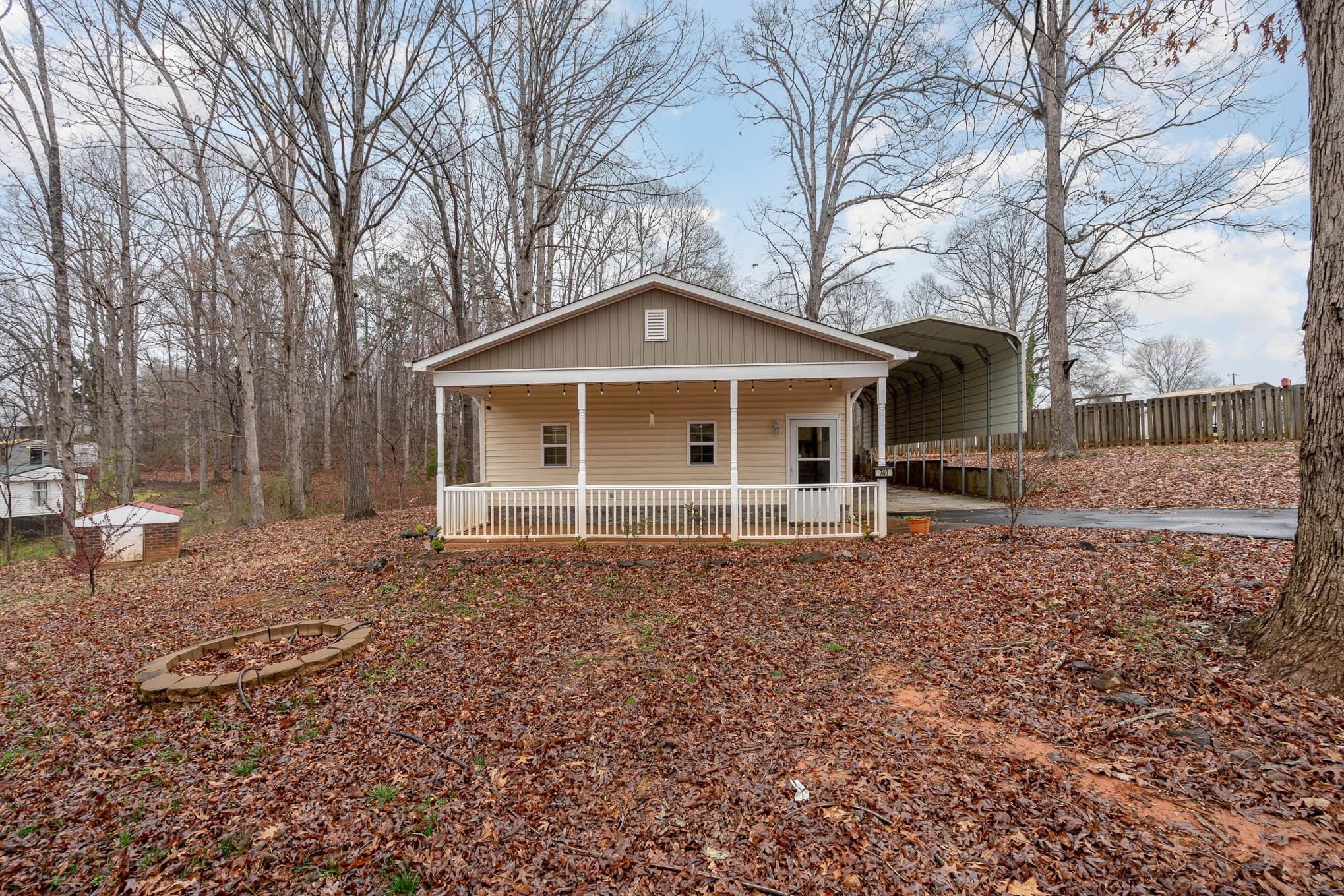 740 Shannon Meadow Road Clover, SC 29710 - Photo 1 of 31 a front view of a house with a garden