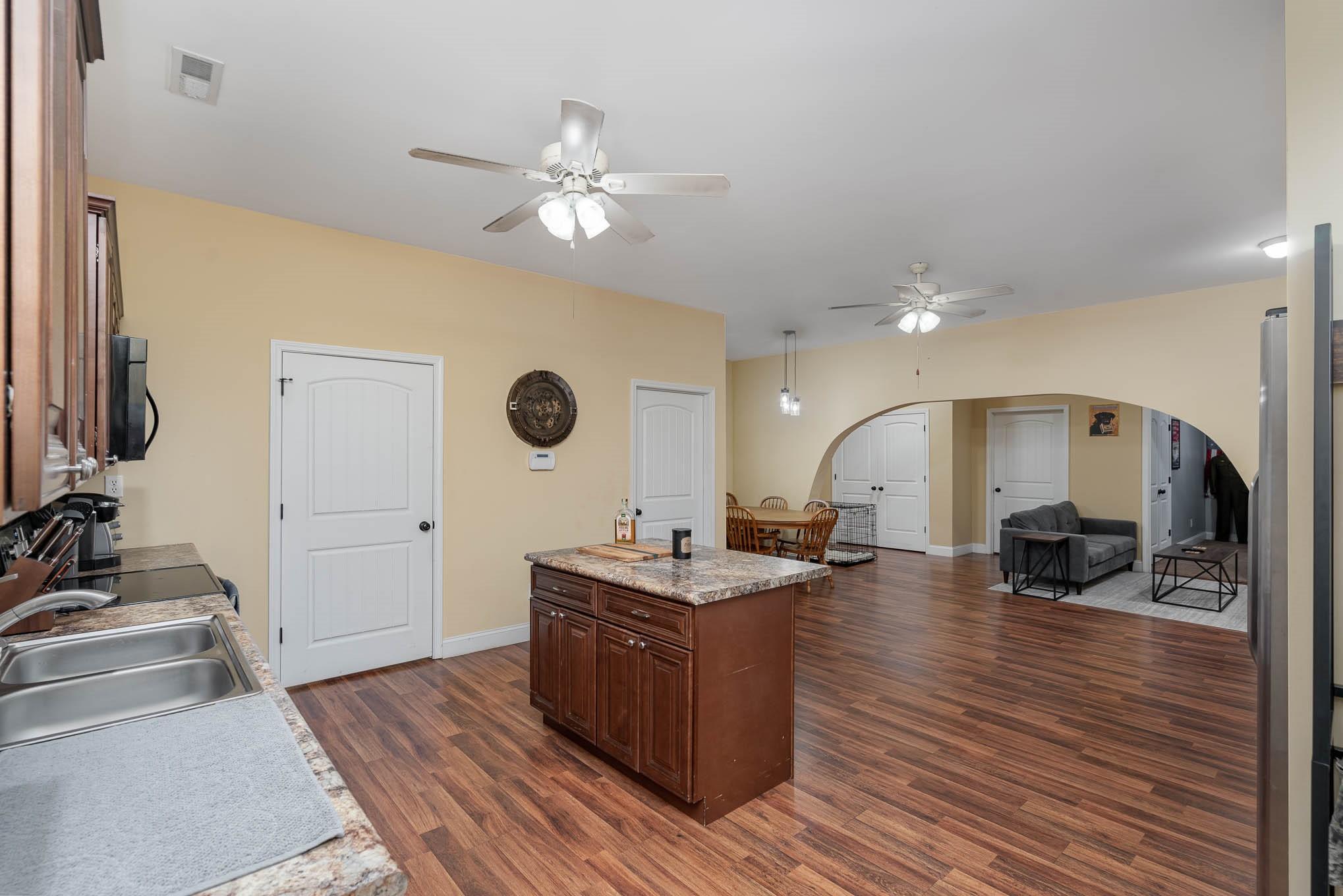 740 Shannon Meadow Road Clover, SC 29710 - Photo 11 of 31 a view of living room with kitchen island furniture and wooden floor