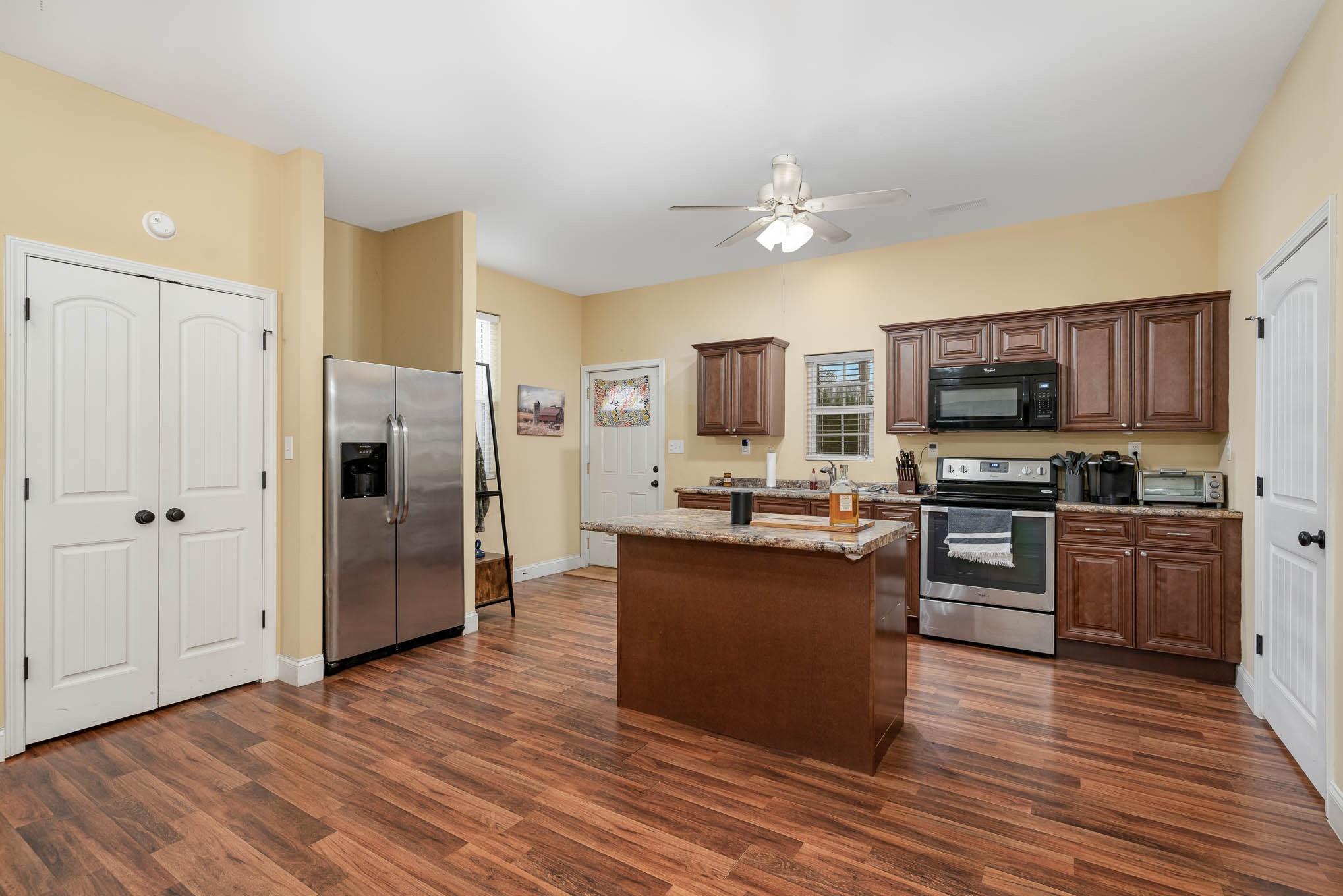740 Shannon Meadow Road Clover, SC 29710 - Photo 14 of 31 a kitchen with stainless steel appliances granite countertop a refrigerator stove and oven