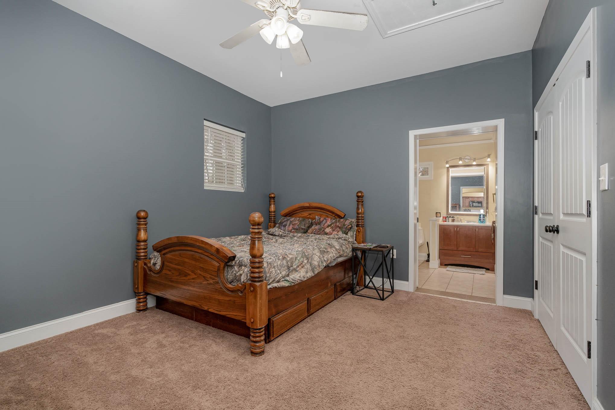 740 Shannon Meadow Road Clover, SC 29710 - Photo 16 of 31 a bedroom with a bed and a chandelier