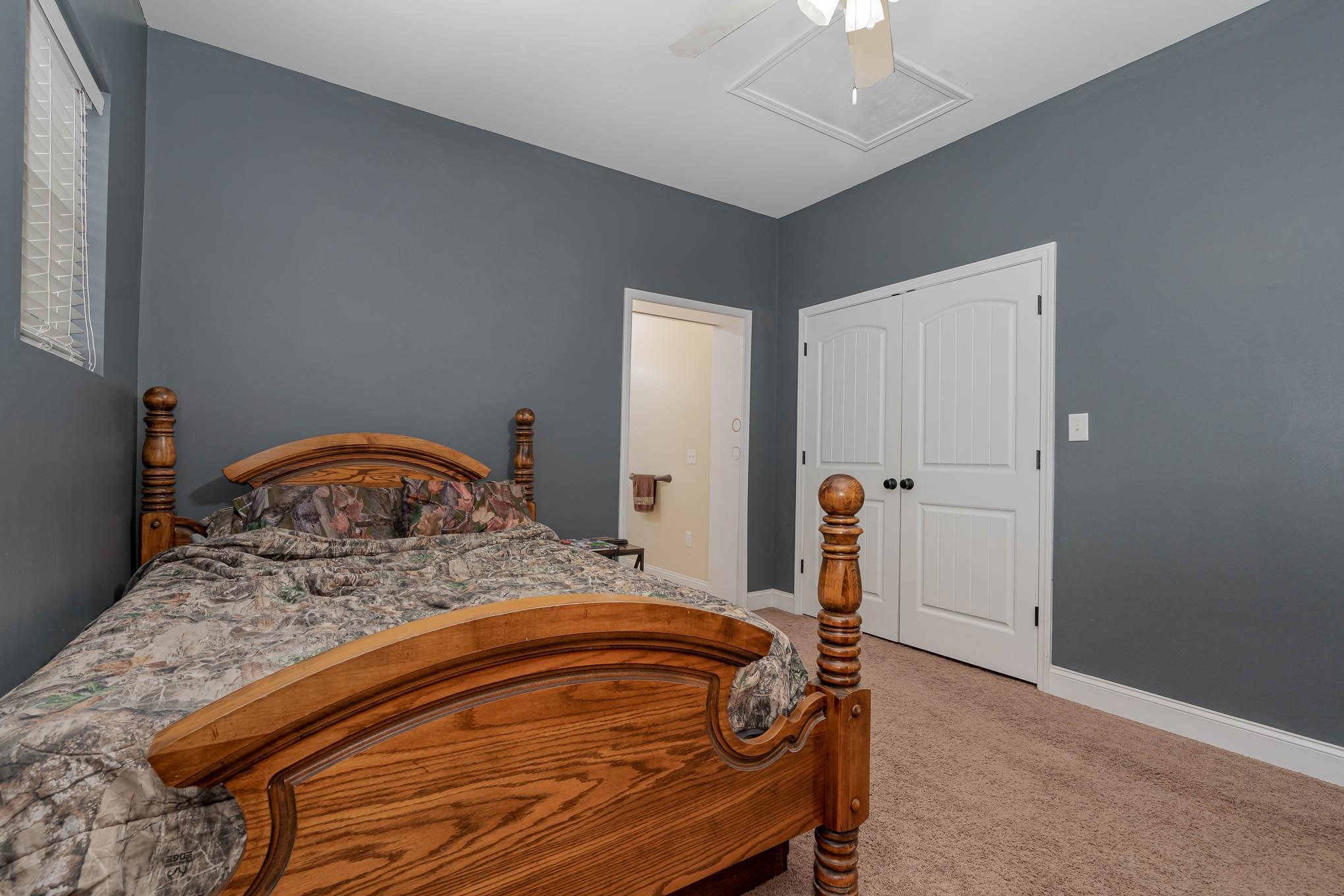 740 Shannon Meadow Road Clover, SC 29710 - Photo 17 of 31 a bedroom with a bed and a chandelier