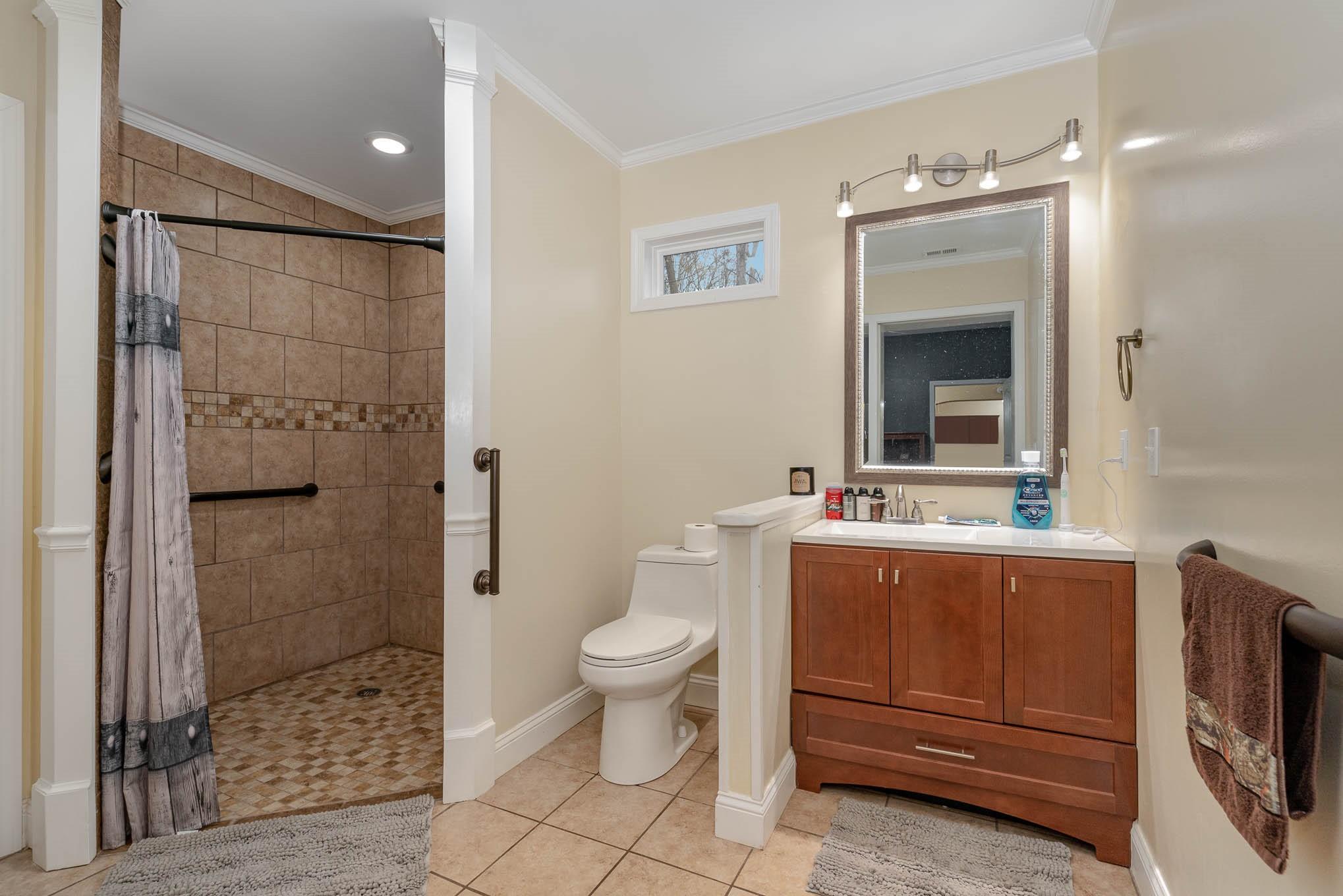 740 Shannon Meadow Road Clover, SC 29710 - Photo 20 of 31 a bathroom with a sink a toilet and shower