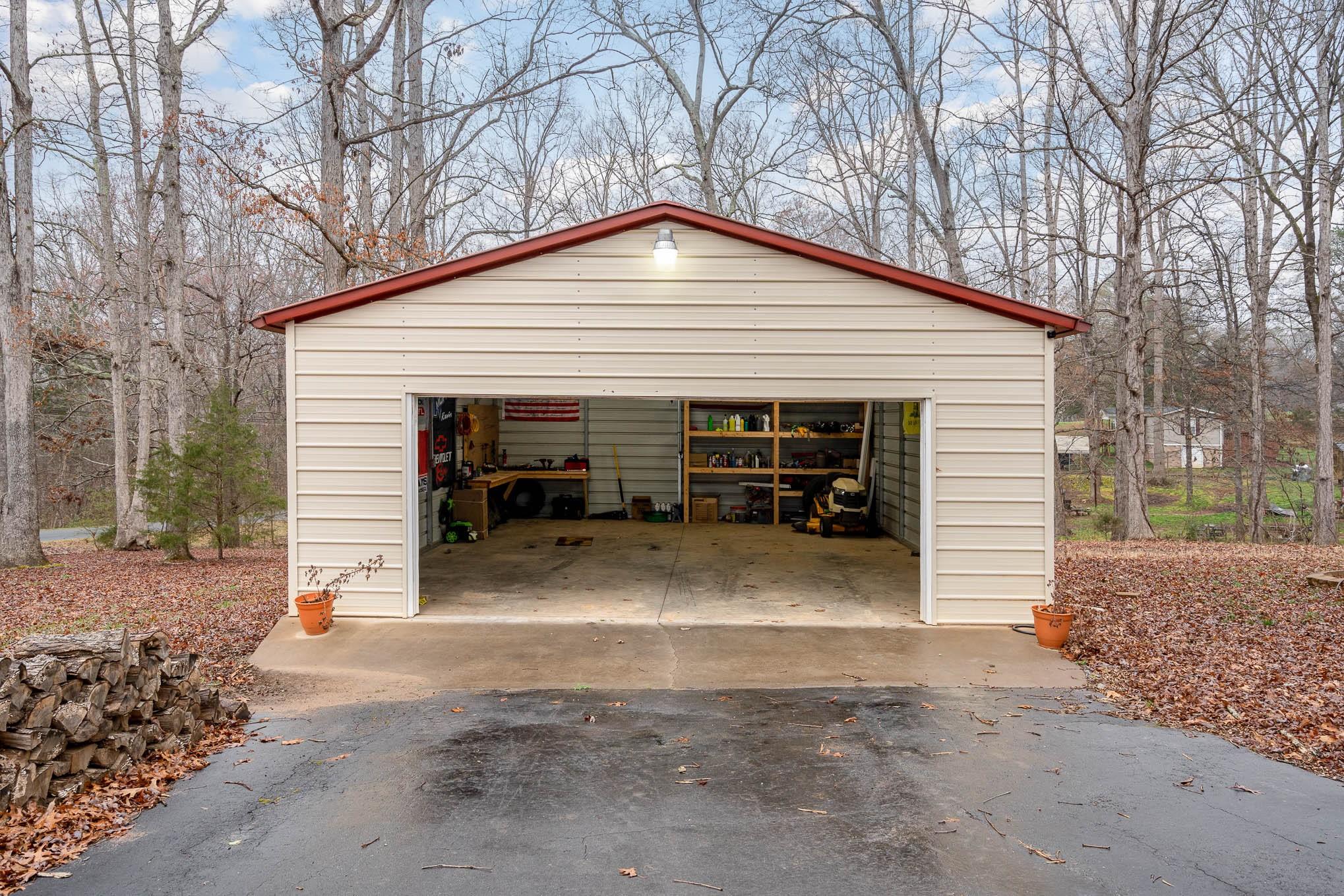 740 Shannon Meadow Road Clover, SC 29710 - Photo 27 of 31 a view of a house with a yard and garage