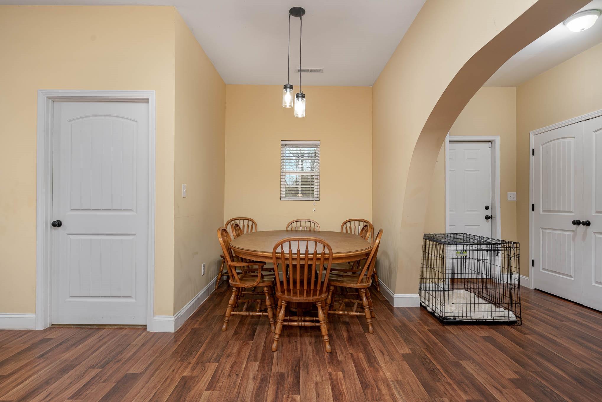 740 Shannon Meadow Road Clover, SC 29710 - Photo 10 of 31 a view of a dining room with furniture and wooden floor