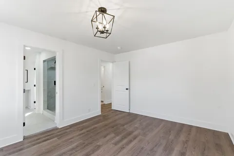 a view of a storage & utility room with wooden floor