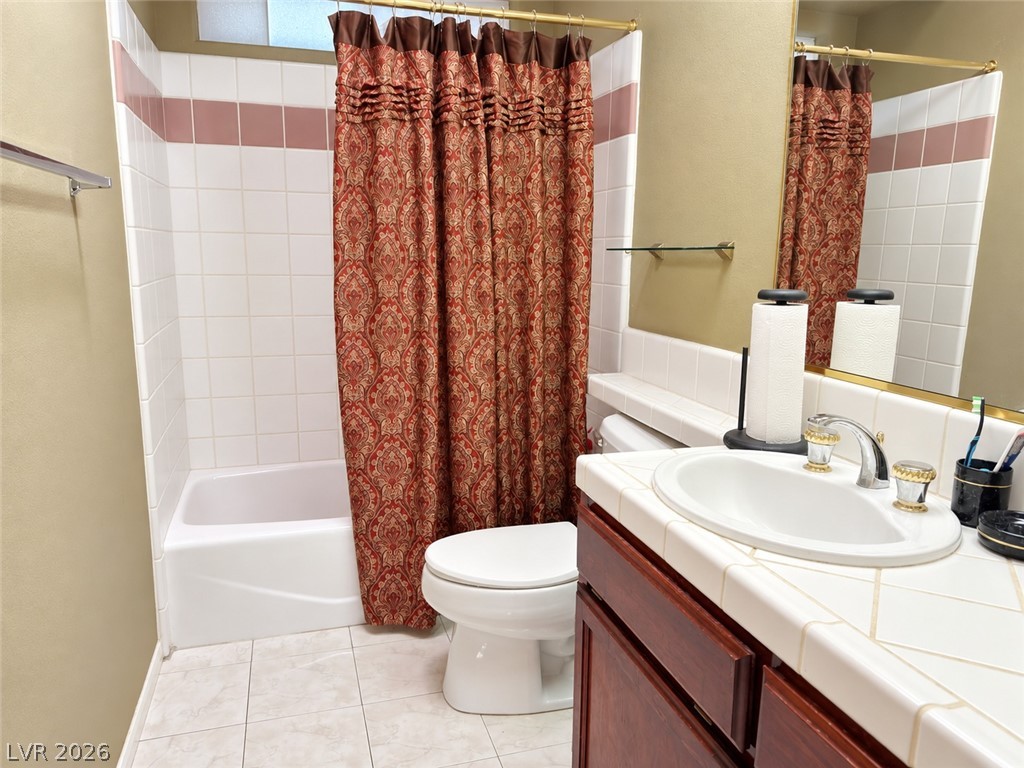 5470 Grain Mill Road Pahrump, NV 89061 - Photo 48 of 80 Hallway bathroom which includes a linen closet, classic tiled surfaces and a matching vanity define this functional bathroom space.