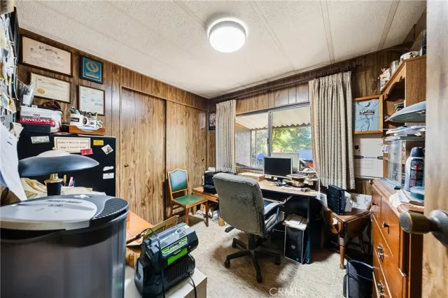 a view of a livingroom with furniture and a window