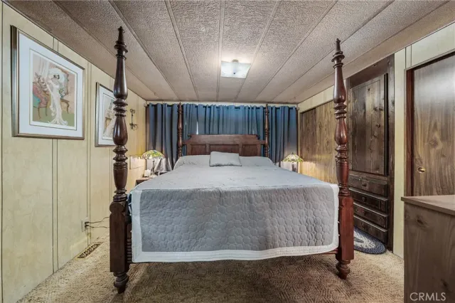 a bed room with a bed and a walk in closet