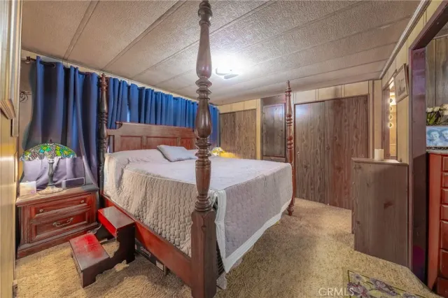 a bed room with a bed and a couch