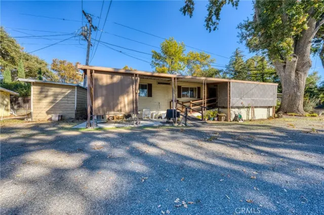 a view of a backyard with a patio