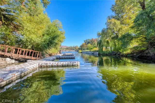 a view of a lake with a house in the background