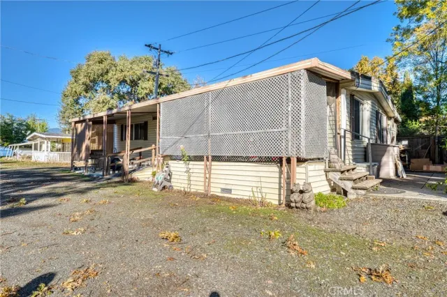 a view of a house with a backyard
