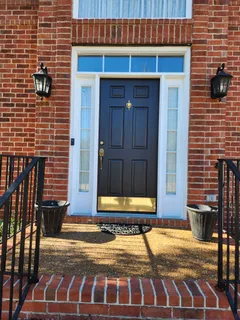 a view of a brick house with an outdoor space