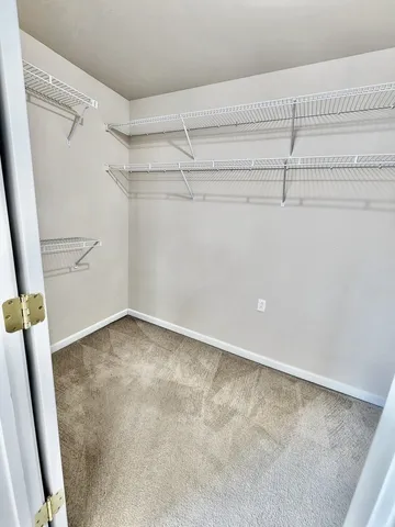 a spacious bathroom with a sink a mirror and a bathtub