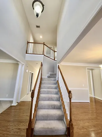 a view of staircase with white walls