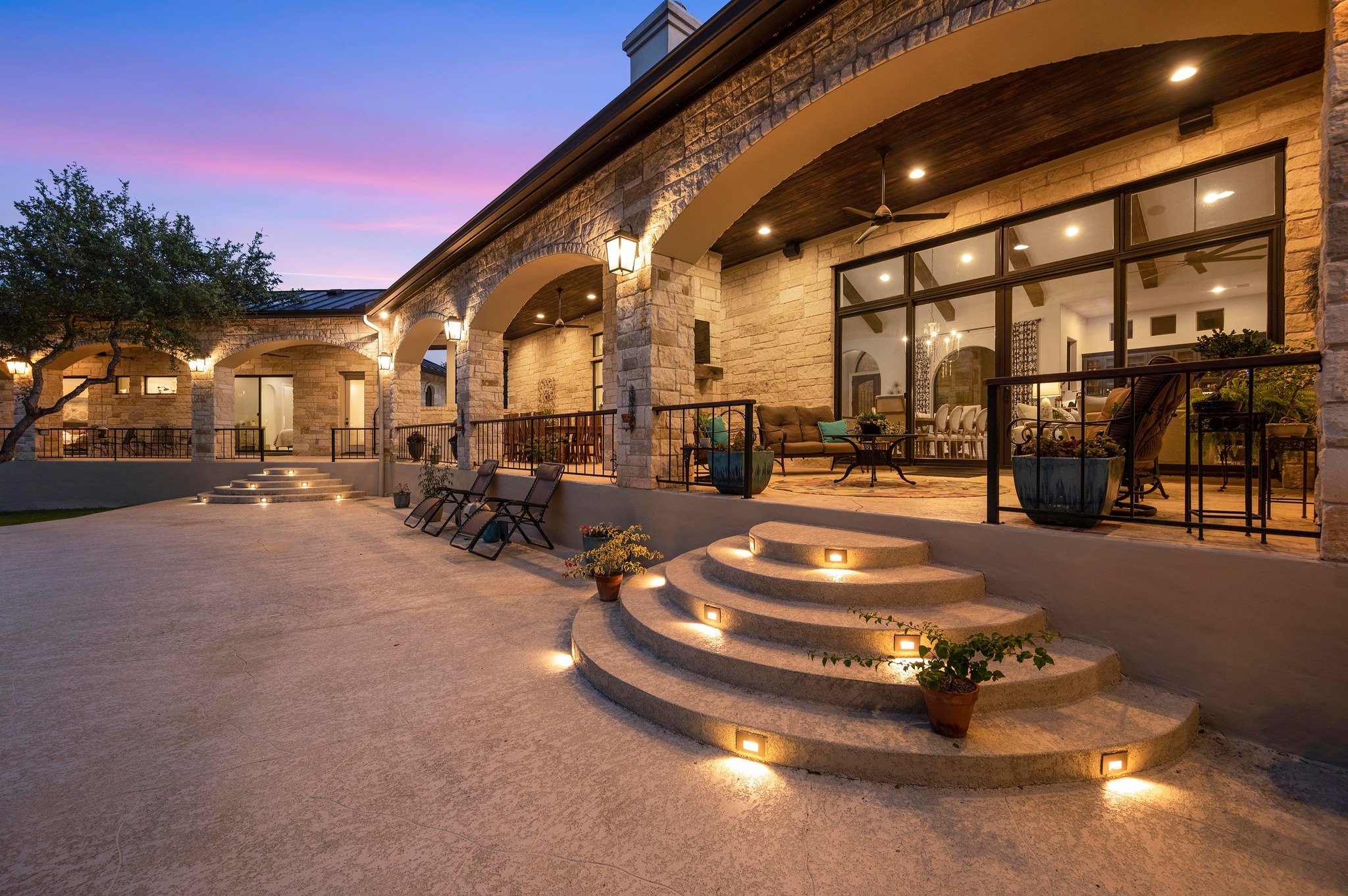 401 Trail Ridge Road Wimberley, TX 78676 - Photo 28 of 34 Patio terrace at dusk featuring a patio area and ceiling fan