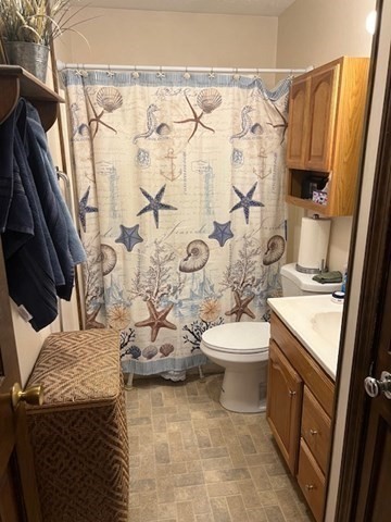 178 Walnut Street Barnstable, MA 02601 - Photo 6 of 12 a bathroom with a sink a toilet and shower curtain