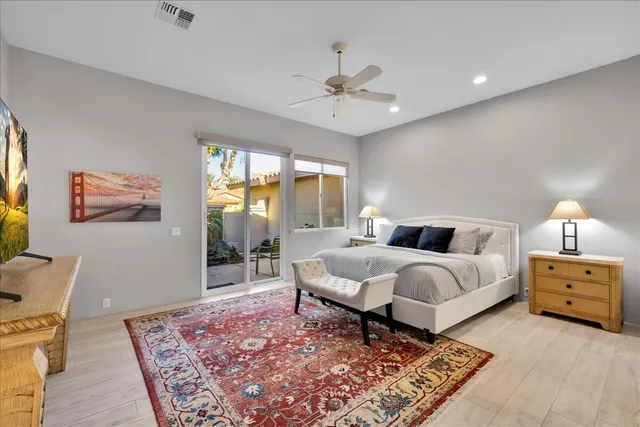 a living room with furniture and a baby crib