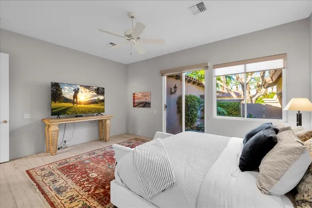a large bathroom with a double vanity sink a mirror and a bathtub