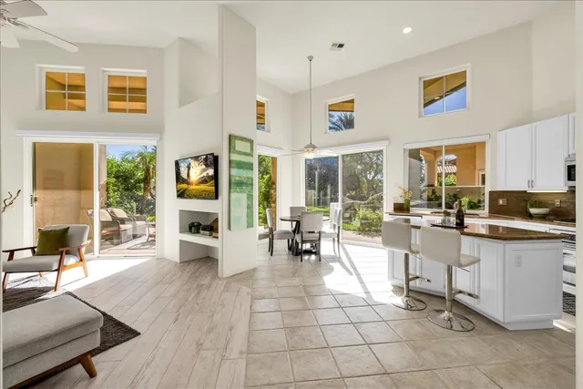 a living room with granite countertop furniture and a large window