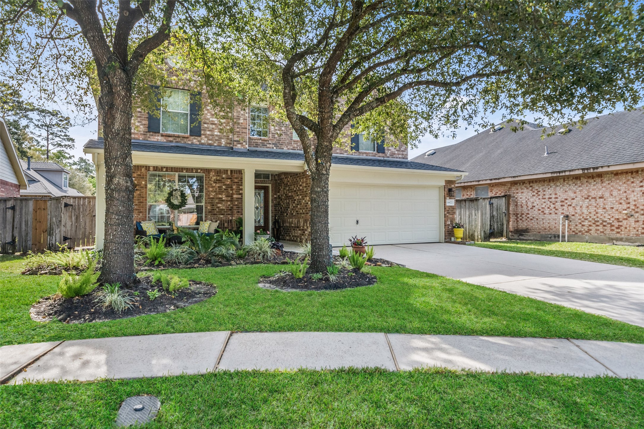 14422 Andrews Ridge Lane Humble, TX 77396 - Photo 11 of 40 a front view of a house with a garden and yard