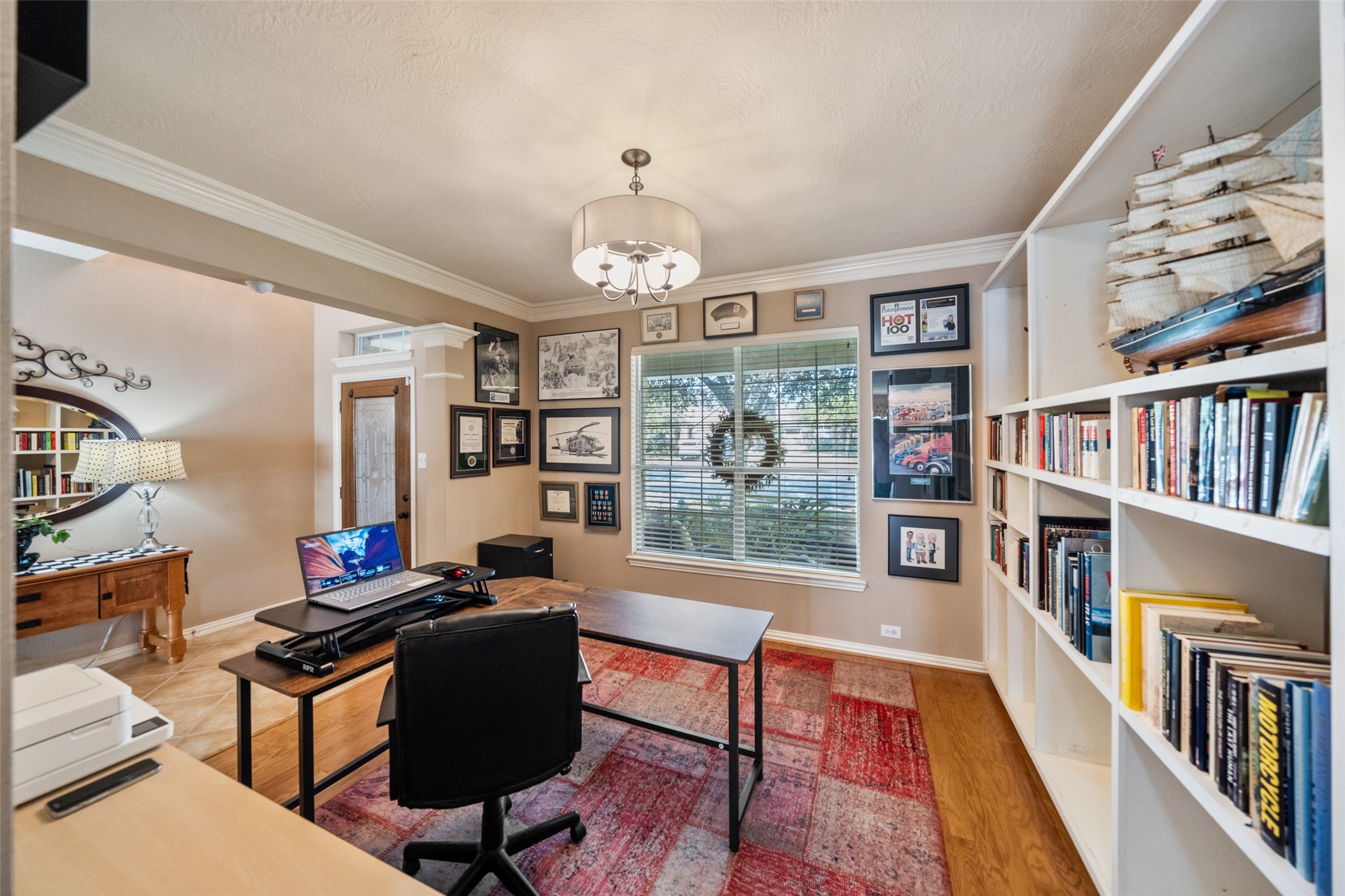 14422 Andrews Ridge Lane Humble, TX 77396 - Photo 14 of 40 a living room with fireplace furniture and a book shelf