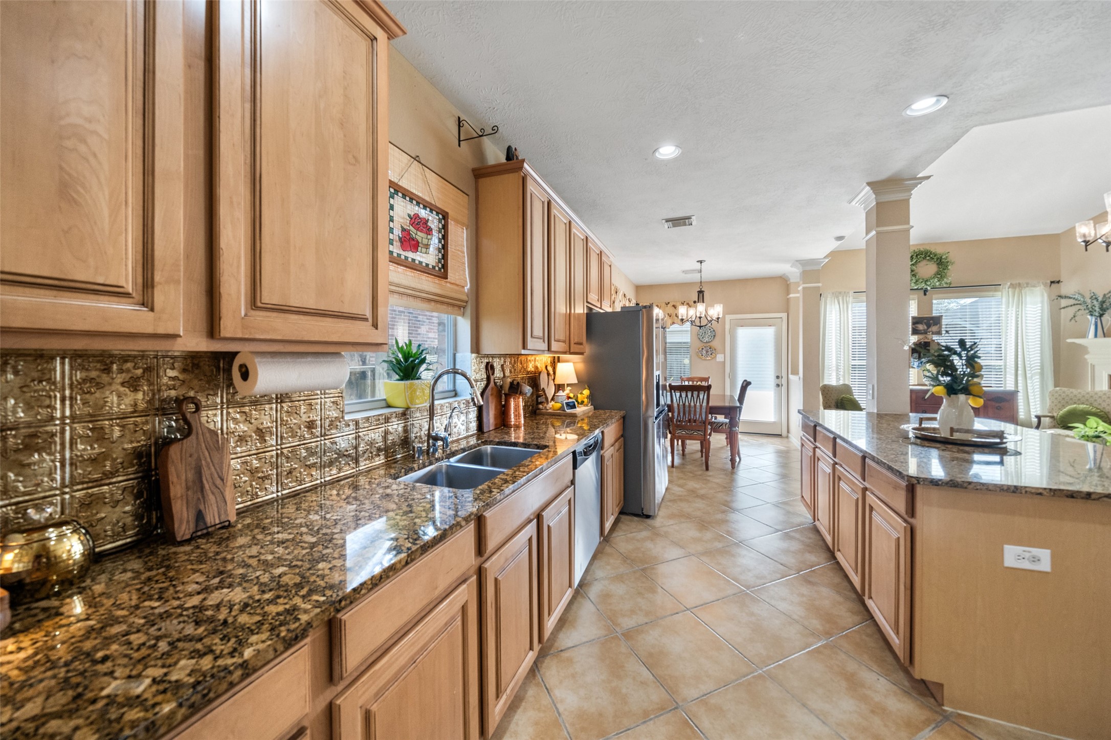 14422 Andrews Ridge Lane Humble, TX 77396 - Photo 16 of 40 a kitchen with stainless steel appliances granite countertop a sink and cabinets