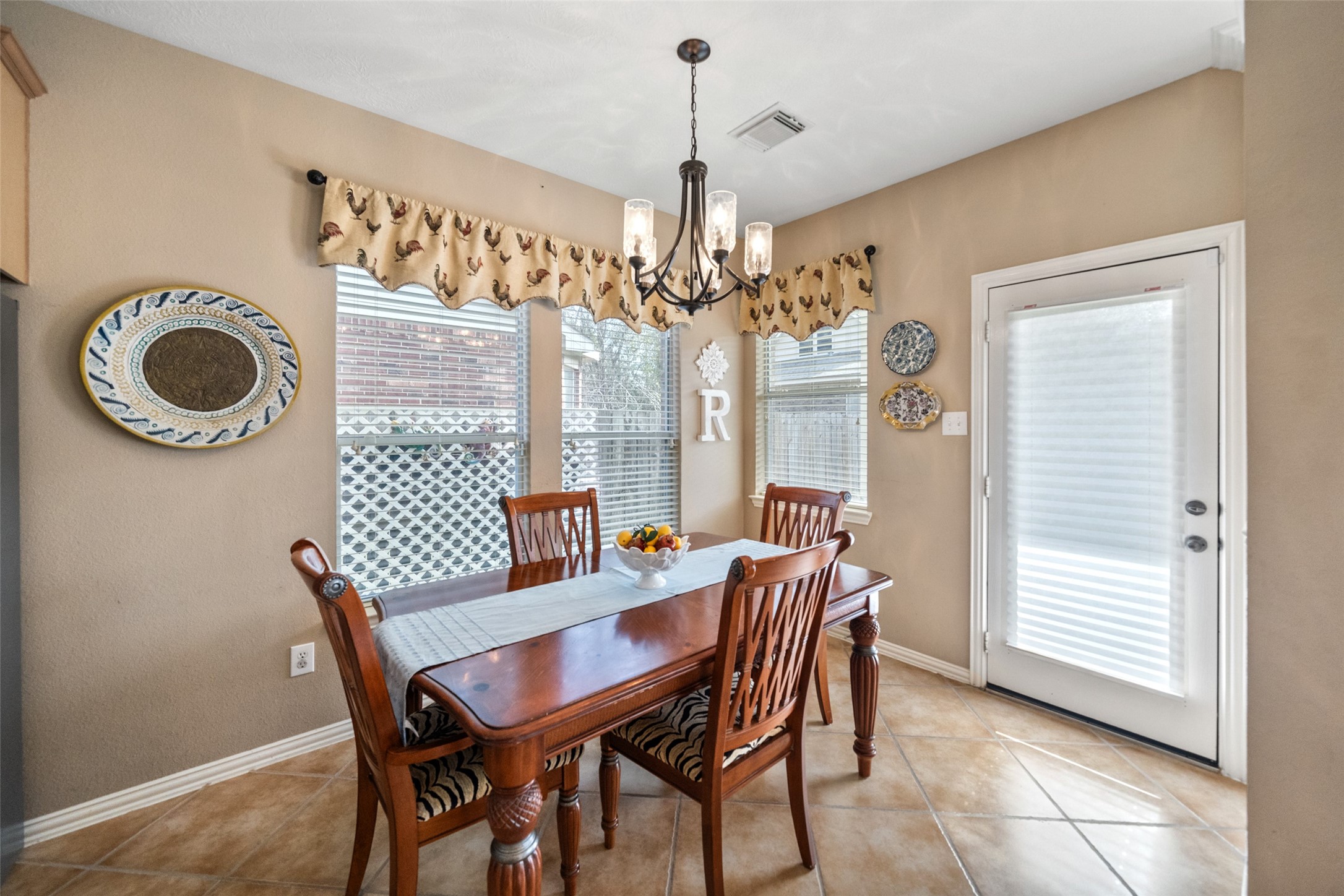 14422 Andrews Ridge Lane Humble, TX 77396 - Photo 19 of 40 a view of a dining room with furniture and chandelier