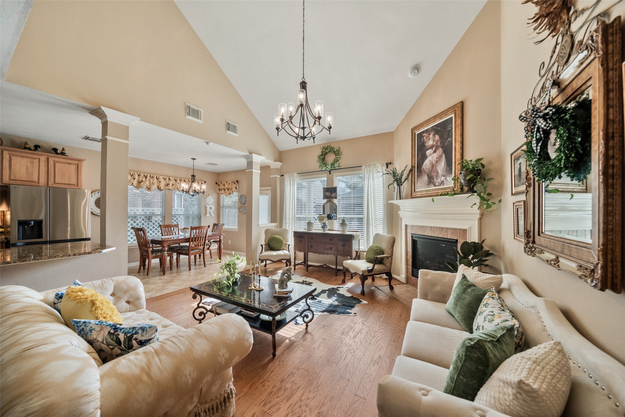 14422 Andrews Ridge Lane Humble, TX 77396 - Photo 22 of 40 a living room with furniture fireplace and a chandelier