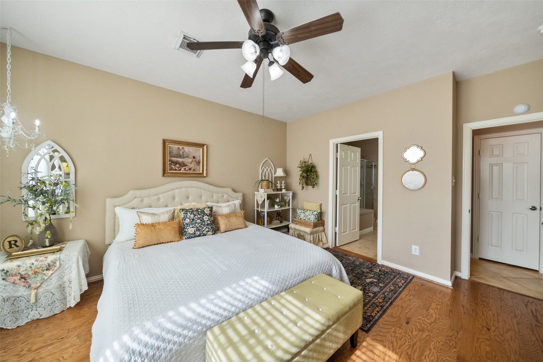 14422 Andrews Ridge Lane Humble, TX 77396 - Photo 25 of 40 a bedroom with a bed and wooden floor