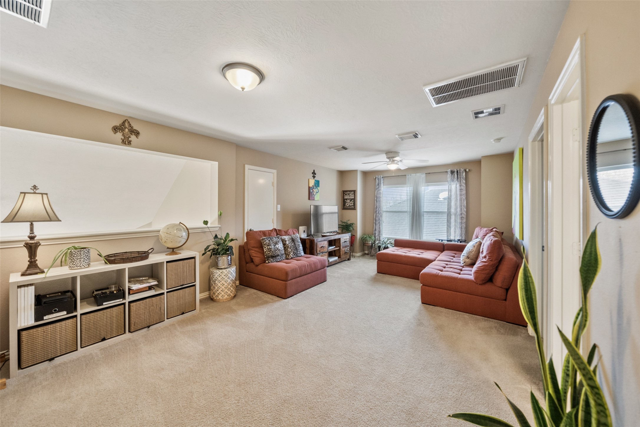 14422 Andrews Ridge Lane Humble, TX 77396 - Photo 27 of 40 a living room with furniture a fireplace and a large window