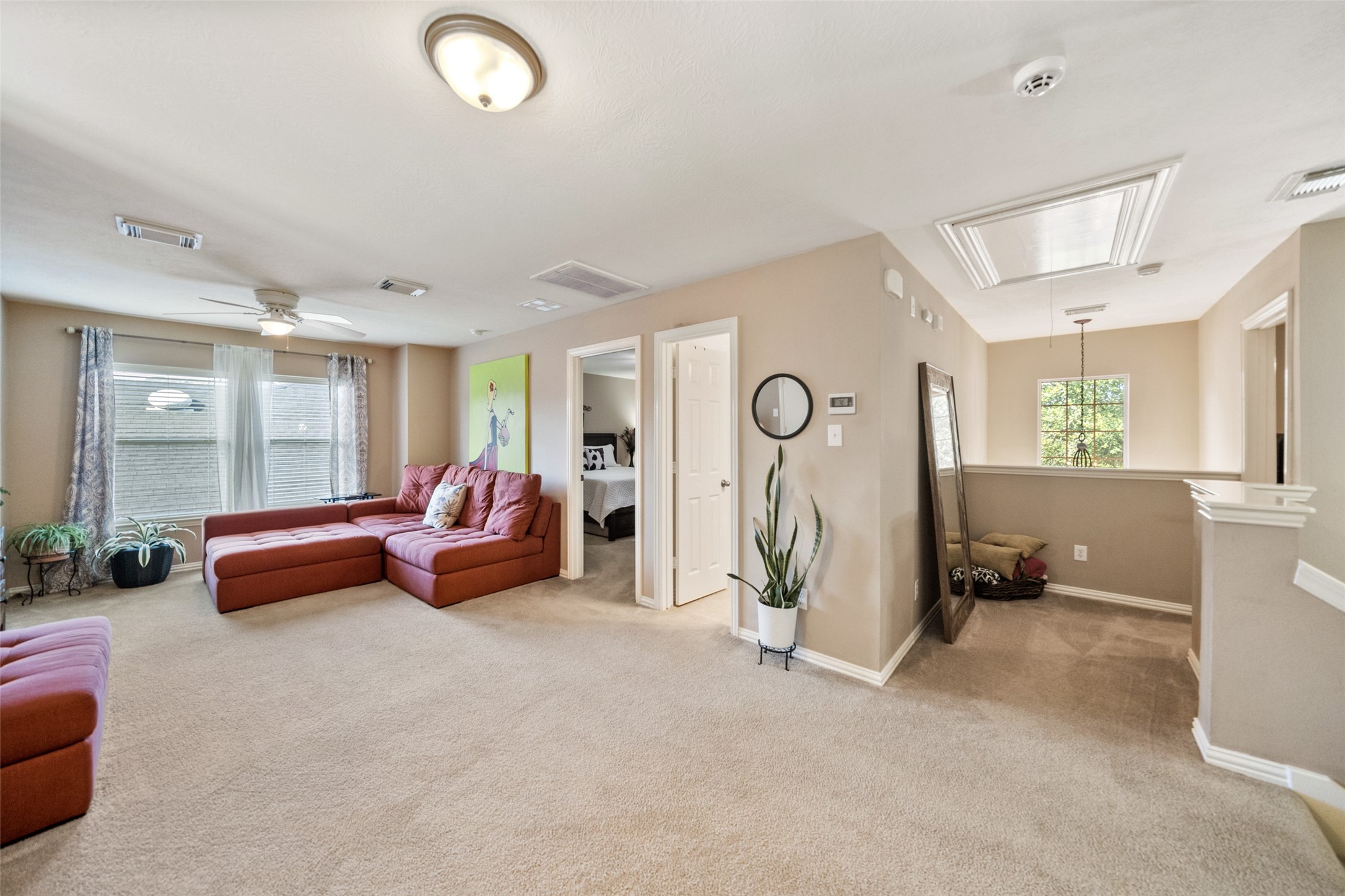 14422 Andrews Ridge Lane Humble, TX 77396 - Photo 28 of 40 a living room with furniture gym equipment and a large window