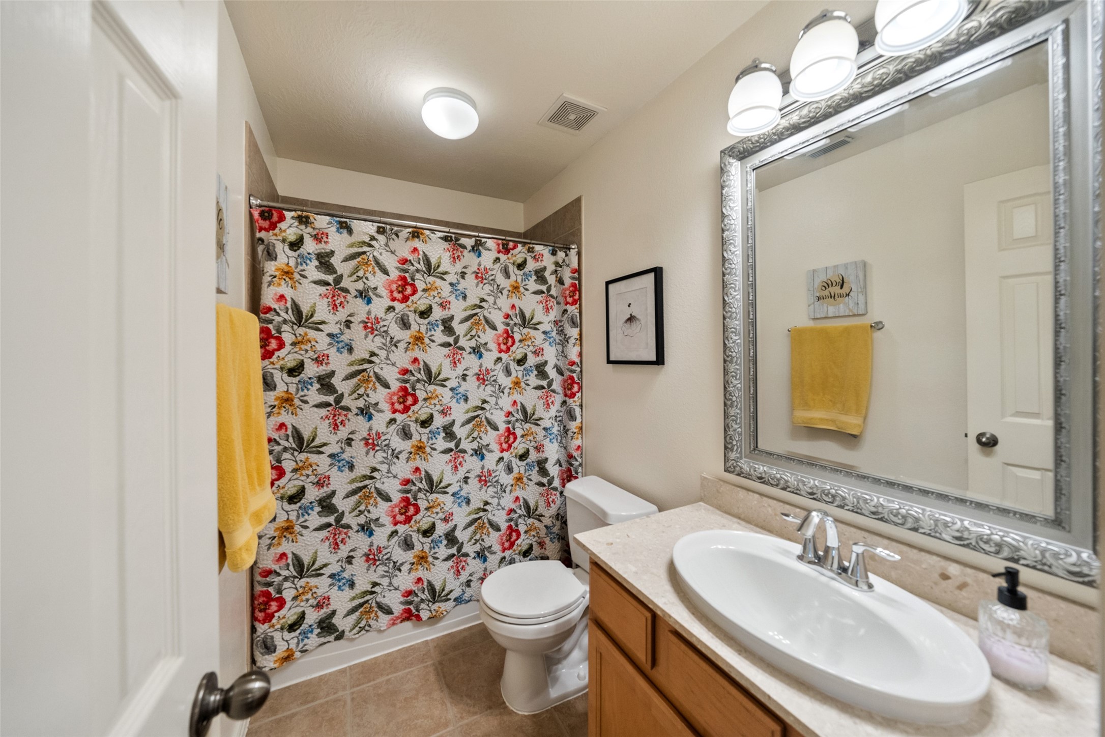 14422 Andrews Ridge Lane Humble, TX 77396 - Photo 33 of 40 a bathroom with a sink toilet and shower