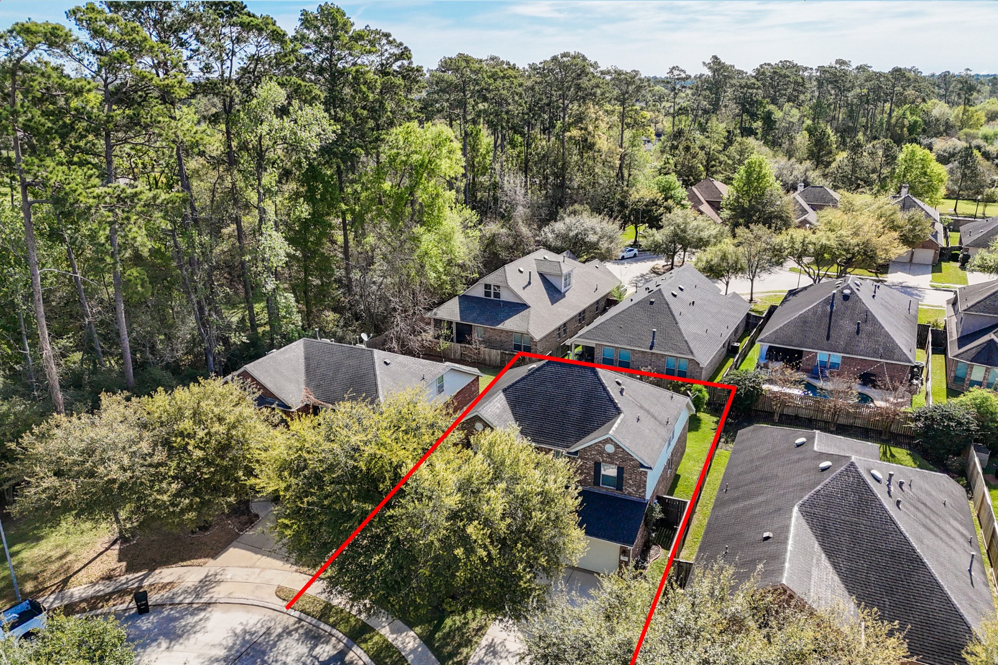 14422 Andrews Ridge Lane Humble, TX 77396 - Photo 39 of 40 a aerial view of a house with swimming pool and trees