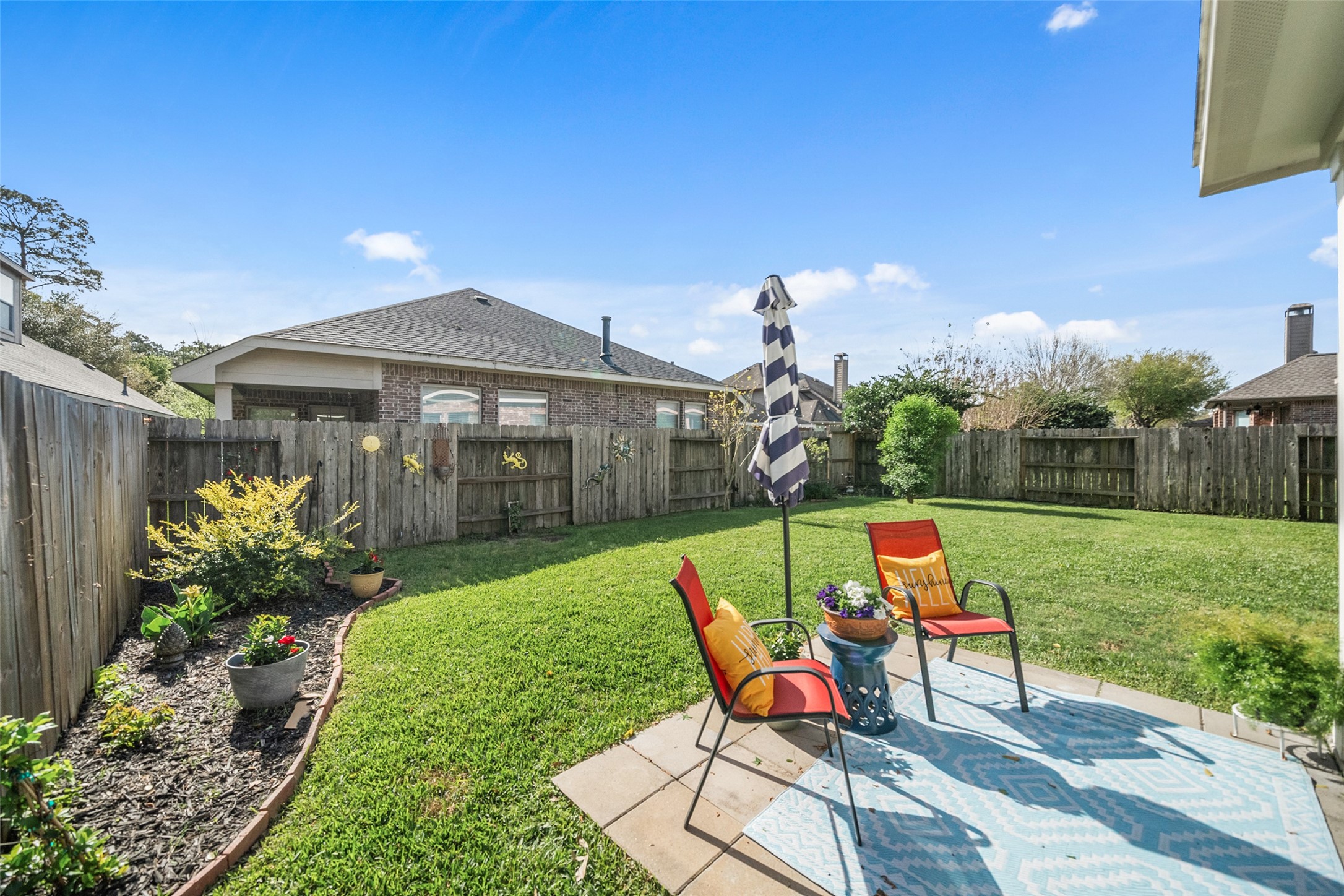 14422 Andrews Ridge Lane Humble, TX 77396 - Photo 8 of 40 a view of a house with backyard sitting area and garden