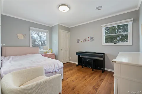 a bedroom with a bed and a workspace