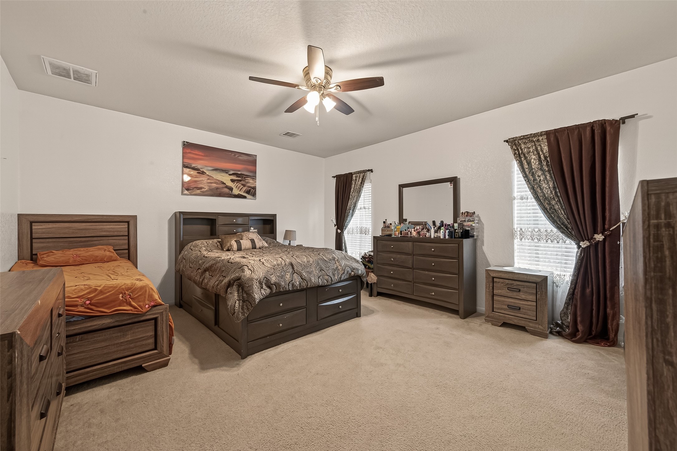 18303 All Oak Trail Houston, TX 77084 - Photo 11 of 31 a bedroom with furniture and a flat tv screen