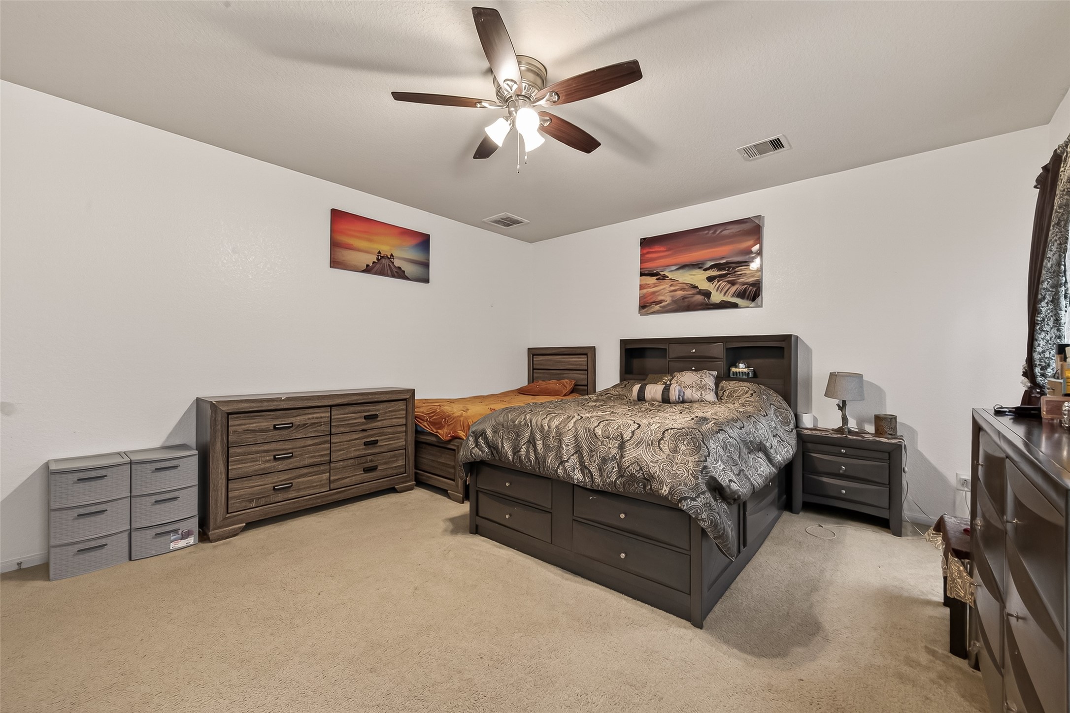18303 All Oak Trail Houston, TX 77084 - Photo 12 of 31 a bedroom with a bed dresser and wooden floor