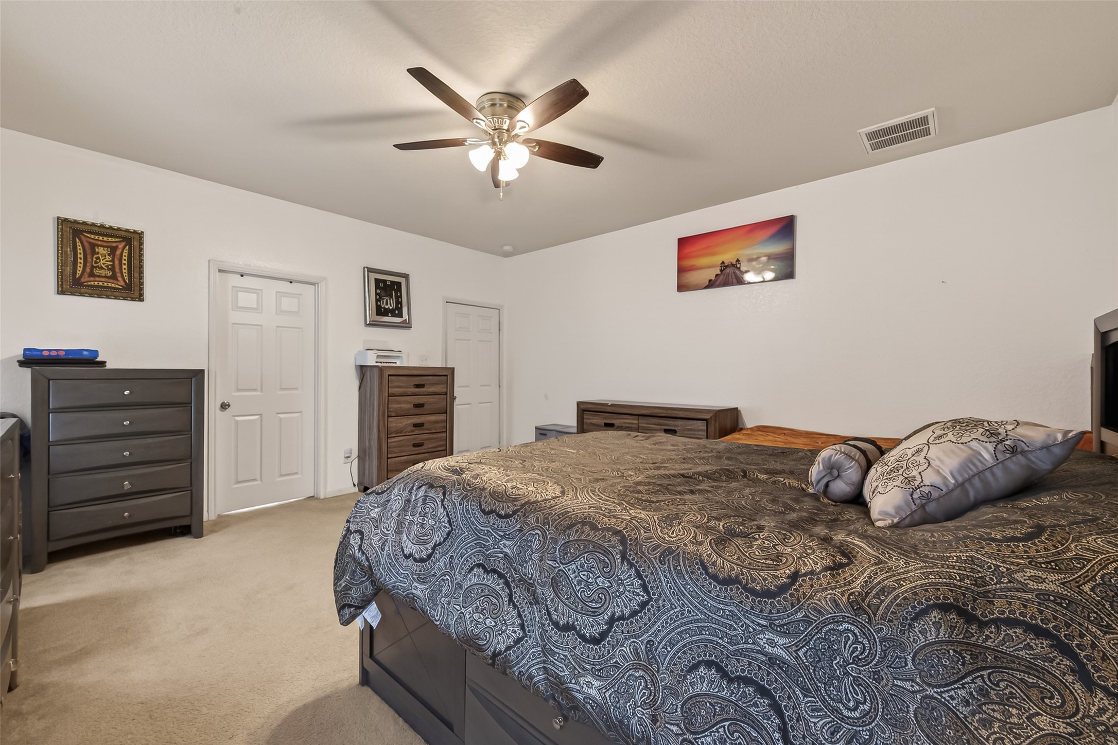 18303 All Oak Trail Houston, TX 77084 - Photo 13 of 31 a bedroom with a bed and a dresser
