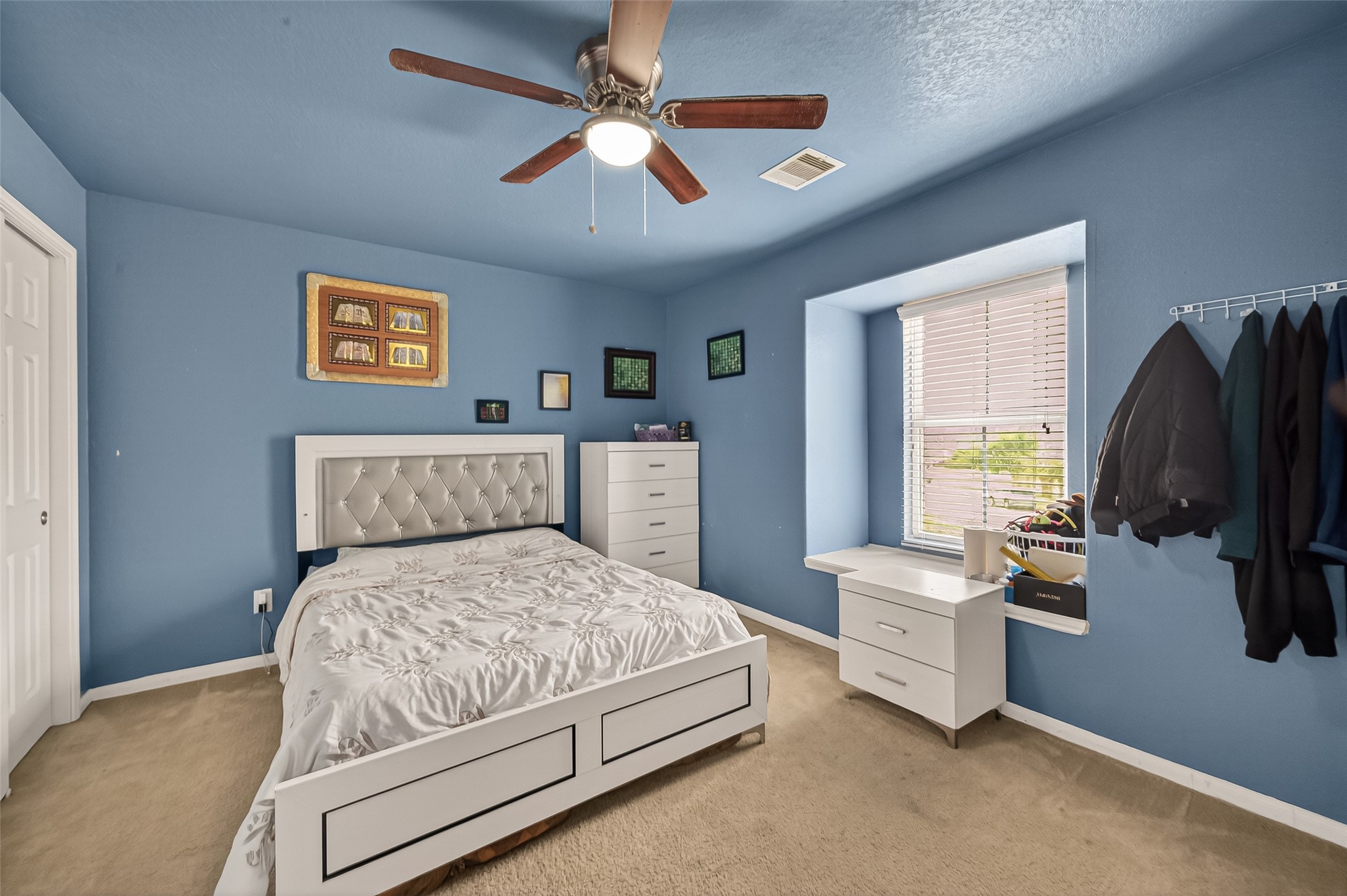 18303 All Oak Trail Houston, TX 77084 - Photo 18 of 31 a bedroom with a bed couch and a window