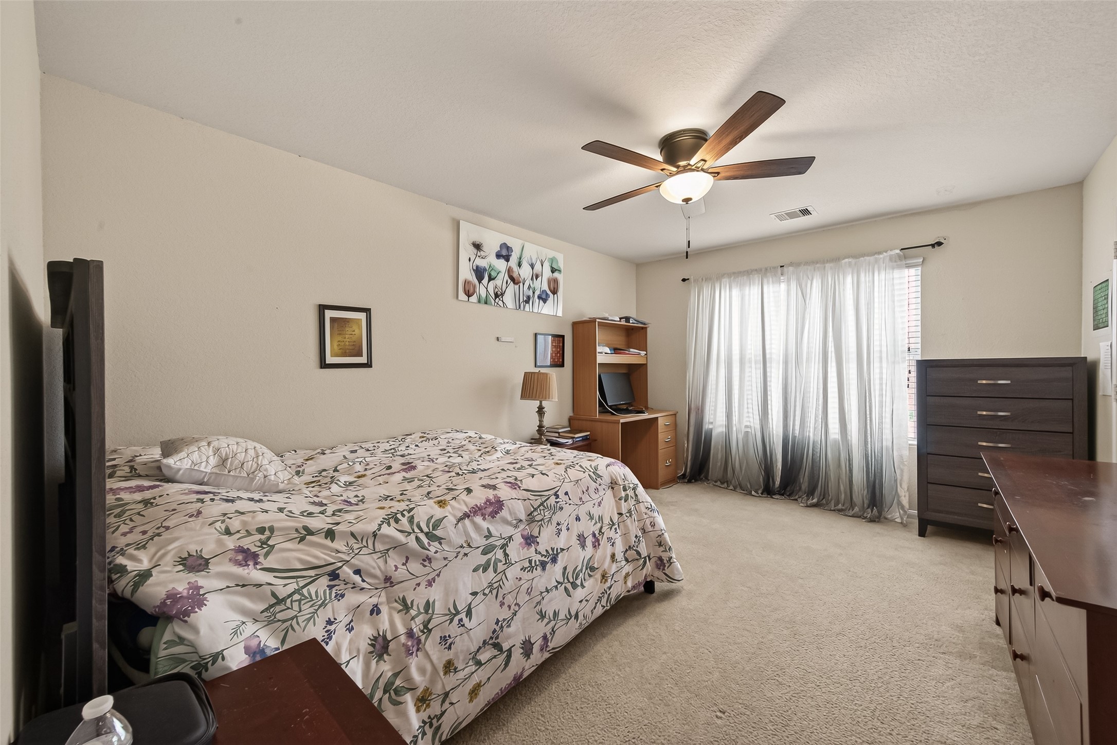 18303 All Oak Trail Houston, TX 77084 - Photo 23 of 31 a bedroom with a bed dresser and a window
