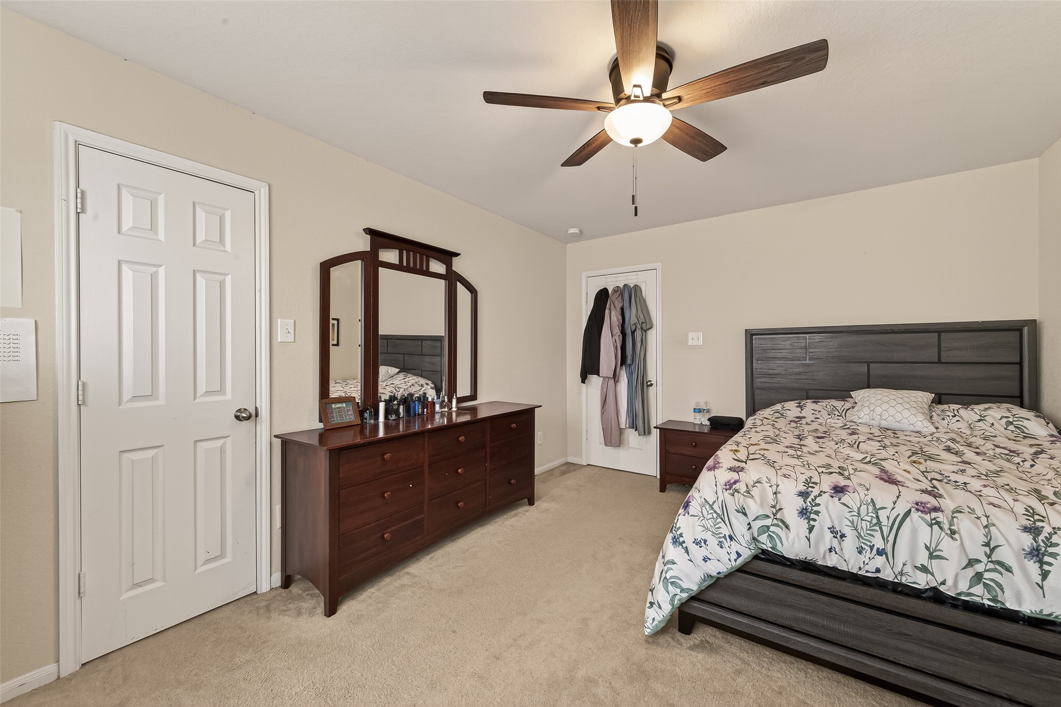 18303 All Oak Trail Houston, TX 77084 - Photo 24 of 31 a bedroom with a bed a dresser and large mirror