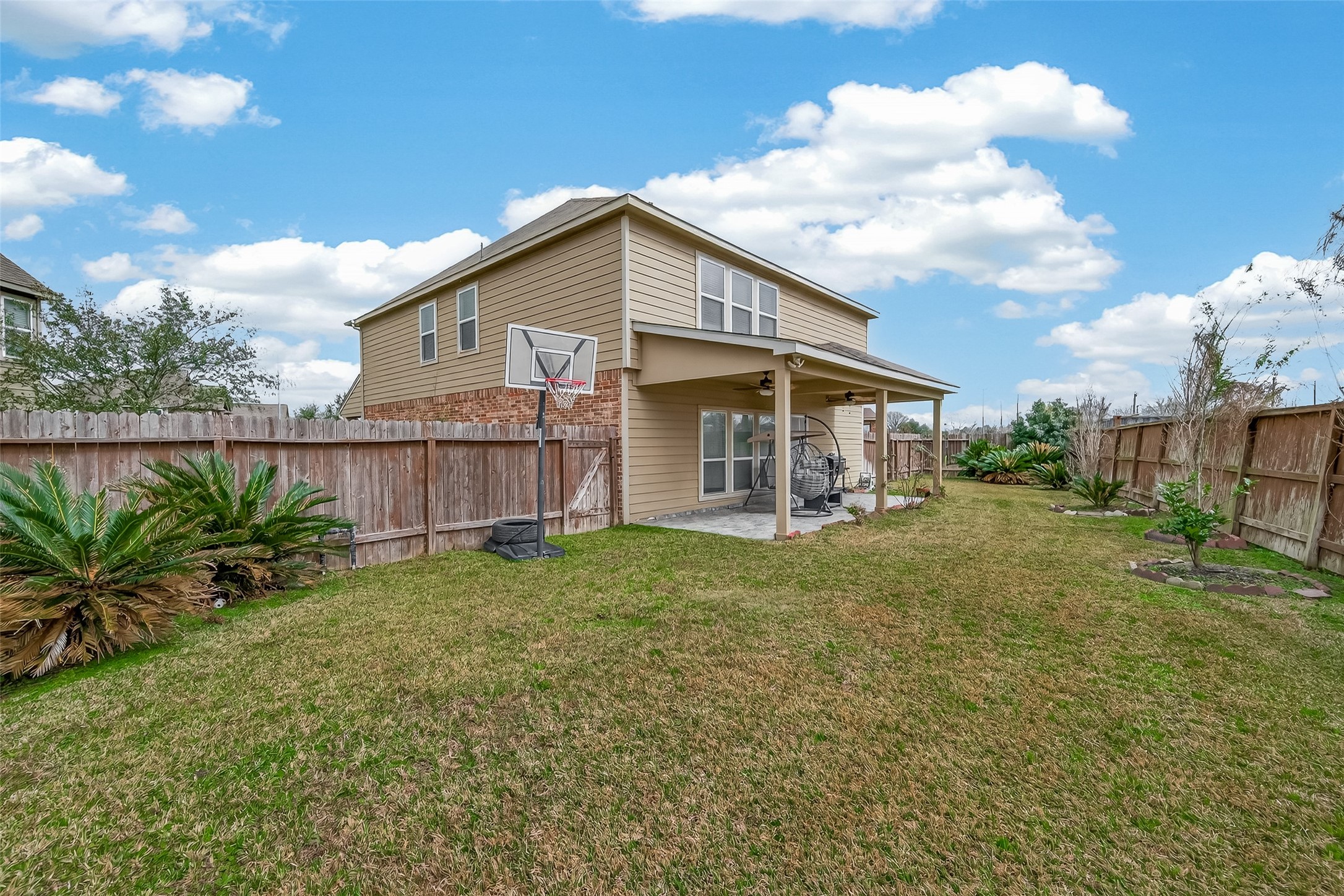 18303 All Oak Trail Houston, TX 77084 - Photo 31 of 31 a view of a house with backyard and garden