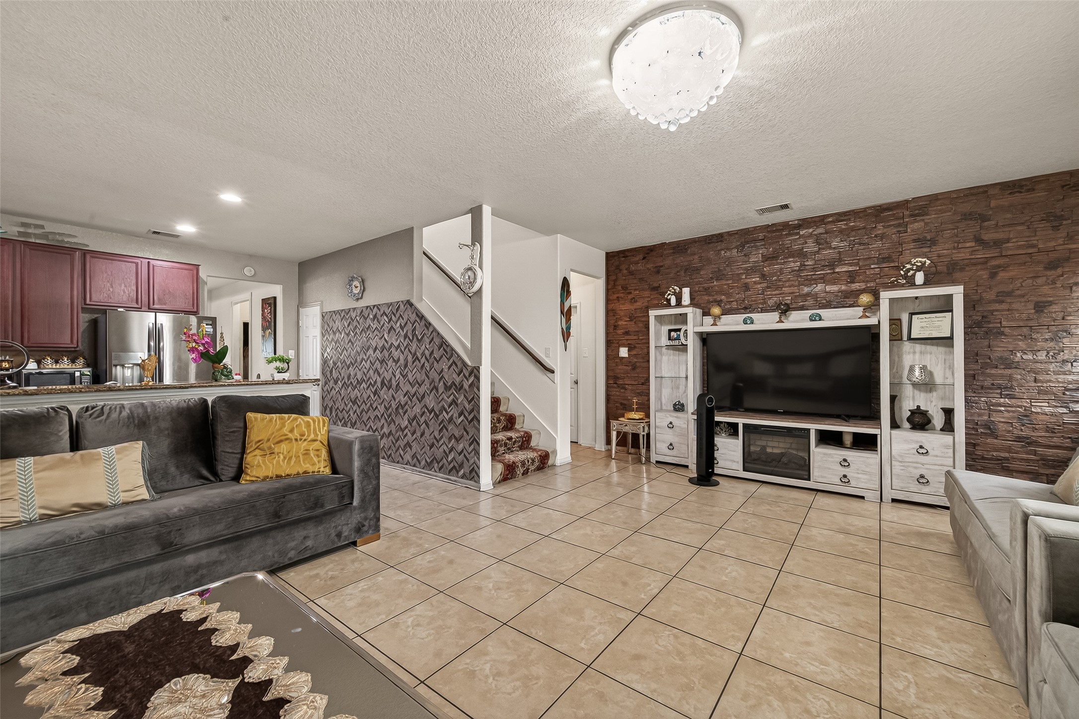 18303 All Oak Trail Houston, TX 77084 - Photo 8 of 31 a living room with furniture and a flat screen tv