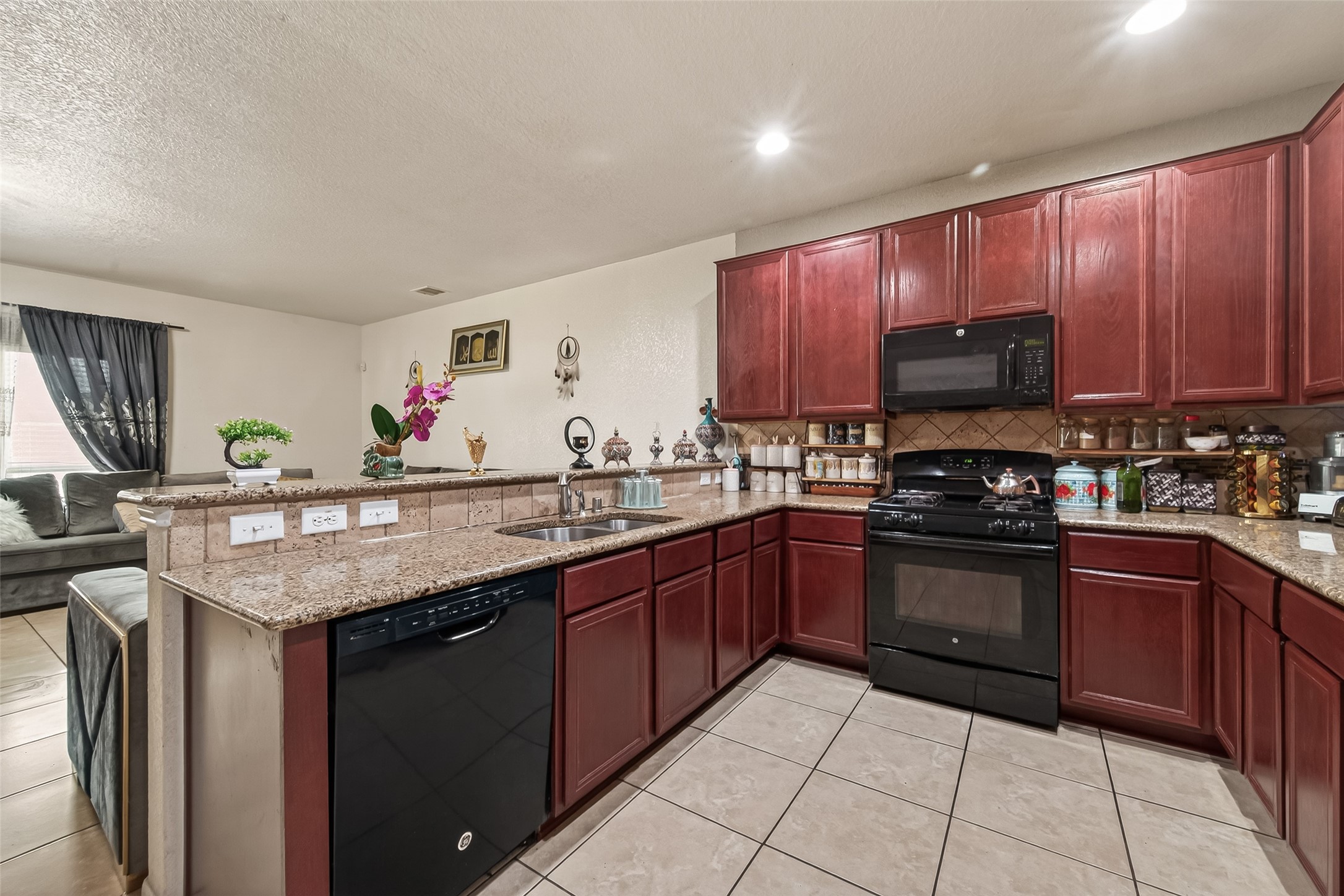 18303 All Oak Trail Houston, TX 77084 - Photo 10 of 31 a kitchen with stainless steel appliances granite countertop a sink dishwasher stove and cabinets