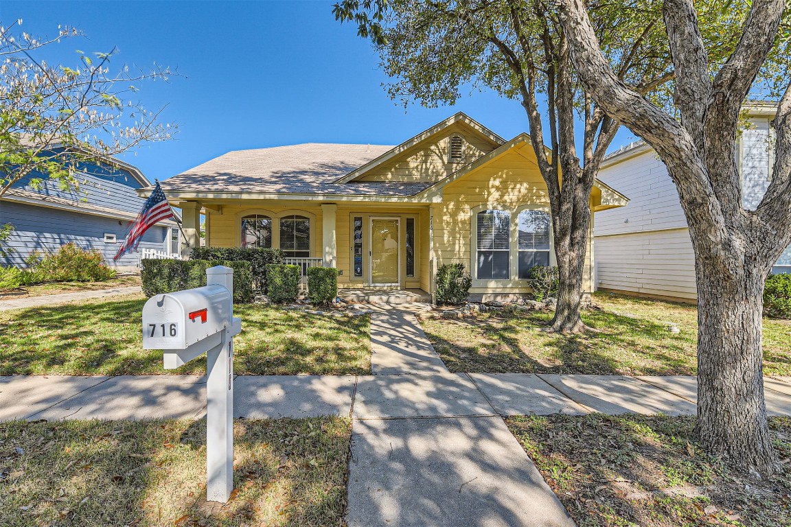 View of front of property with a neighborly front porch.